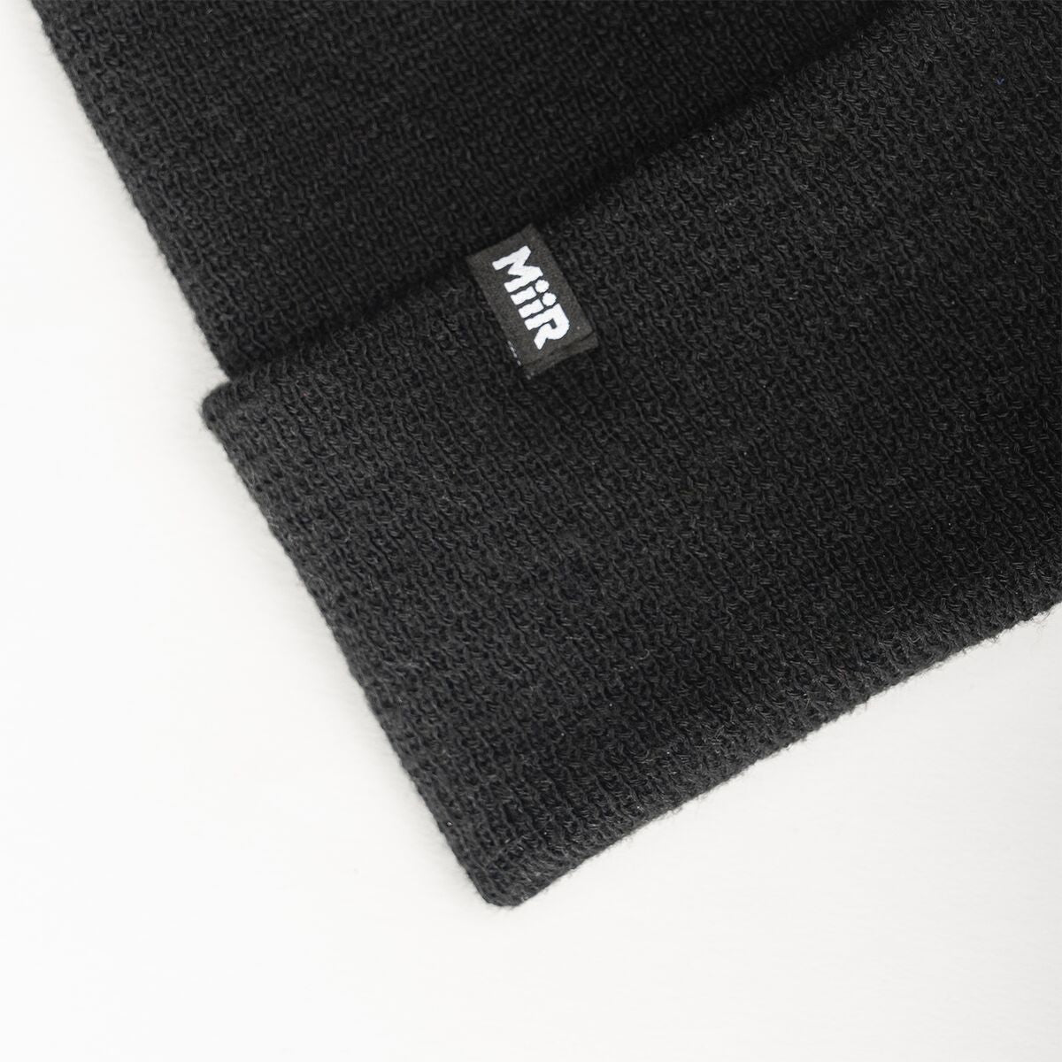 recycled-poly-fine-knit-beanie-c6 WebPDP-RecycledPolyFineKnitBeanie_Studio_TagDetail_Black__BNE005002OS.jpg