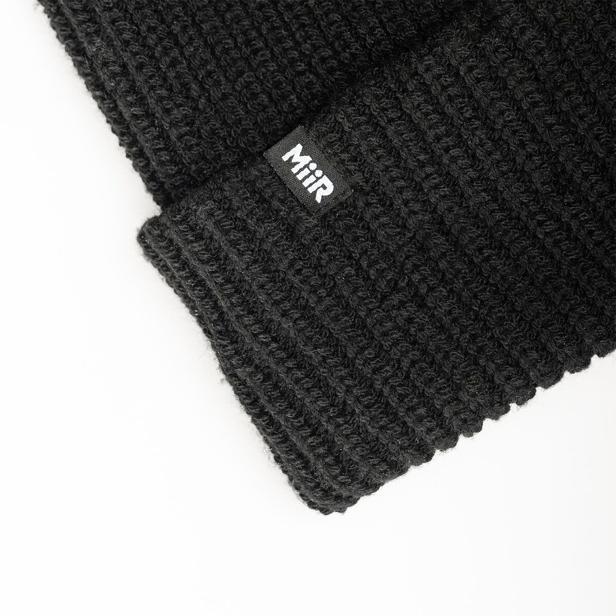 recycled-poly-rib-beanie-g2 WebPDP-RecycledPolyRibBeanie_Studio_TagDetail_Black__BNE002002OS.jpg